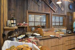 a kitchen with a bunch of food on a counter at Natur-Resort Tripsdrill in Cleebronn