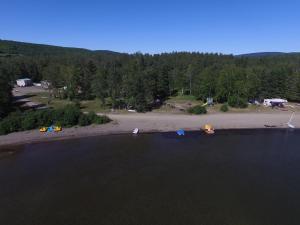an aerial view of a lake with a camping site at dôme près du lac in Saint-Narcisse-de-Rimouski