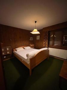 a bedroom with a large bed in a room at Ischwarzsee in Plaffeien