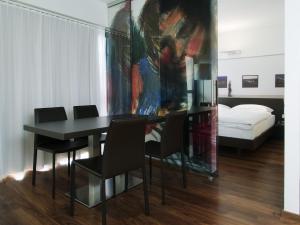 A bed or beds in a room at arte Hotel Linz