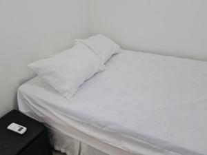 Een bed of bedden in een kamer bij Anequim