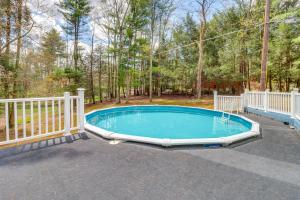 a swimming pool with a white fence around it at East Stroudsburg House with Hot Tub and Pool! in East Stroudsburg