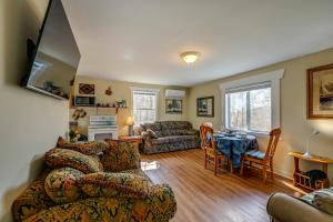 a living room with a couch and a table at Whittier Vacation Rental Cabin Pets Welcome! in Whittier