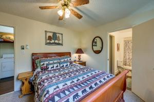 A bed or beds in a room at Whittier Vacation Rental Cabin with Private Hot Tub