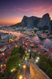an aerial view of a city at night at Old Town Apartment in Omiš