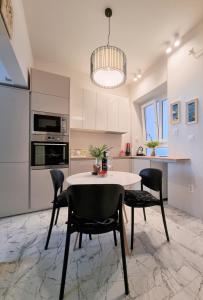 a kitchen with a table and chairs in a room at Old Town Apartment in Omiš