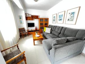 a living room with a couch and a table at Casa Lucy in Garachico