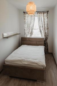 Tempat tidur dalam kamar di Soft Loft