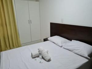 Giường trong phòng chung tại Luxor Tambaú +25 ảnh