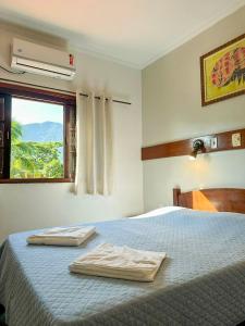 Ein Bett oder Betten in einem Zimmer der Unterkunft Villa'l Mare Hotel
