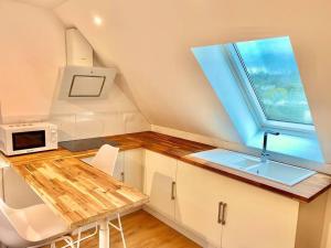 Kuchyňa alebo kuchynka v ubytovaní Appartement rénové proche Gare