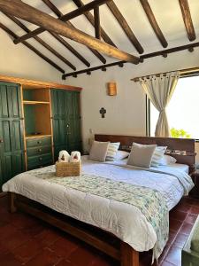 a bedroom with a large bed in a room at Casa Tirteo ( A 500 m de la plaza principal) in Villa de Leyva