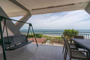 a balcony with a view of the ocean at SEAFRONT SUITE 5 Stars - Comfortable Apartment in Marina di Strongoli