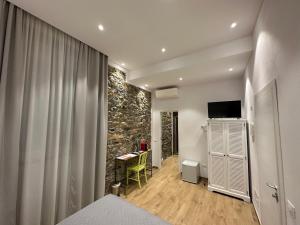 TV a/nebo společenská místnost v ubytování A Ca' De Mananan Guesthouse