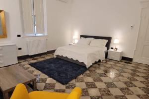 a bedroom with a bed and a table and chairs at Amazing Villa in Migliarino in Migliarino
