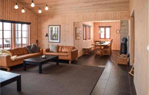 a living room with a couch and a table at Beautiful Home In Gol With Sauna And 4 Bedrooms in Gol