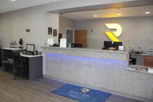 an office with a reception desk and a reception counter at Reston Inn & Suites in Spencer