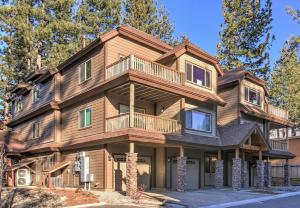 a large wooden house with a balcony at Tahoe Woods Hideout in South Lake Tahoe