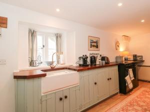 a kitchen with a sink and a window at The Studio in Shaftesbury