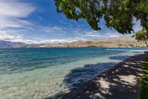 a view of crater lake from the shore at Chelan Resort Suites Sunny Livin 111 in Chelan