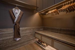 a dressing room with shoes on the floor at The Ritz-Carlton, Nanjing in Nanjing