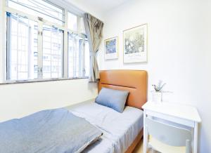 Een bed of bedden in een kamer bij Shared Apartment Lockhart Road 384