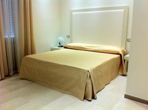 Postel nebo postele na pokoji v ubytování Hotel Europa