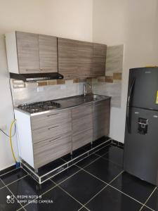 A kitchen or kitchenette at Apartamentos Olaya!