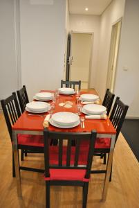 a dining room table set for two with chairs at Apartamentos Portodouro - Santa Catarina in Porto