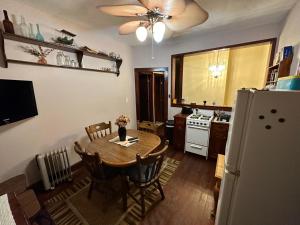 a kitchen with a table and a refrigerator at Little Haven in Highlands