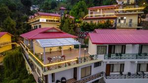 an aerial view of a building with red roofs at Maple Resort Chail in Shimla