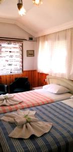 Postel nebo postele na pokoji v ubytování Jasmin Apart Otel