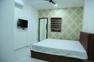 Kurianplackal Residency客房内的一张或多张床位