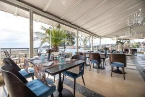 a dining room with a view of the ocean at Hotel Marina in Krk