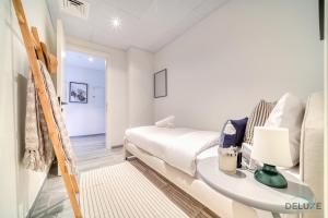 Postel nebo postele na pokoji v ubytování Tranquil 2BR with Assistant Room at Mesk 1 Midtown Dubai Production City by Deluxe Holiday Homes