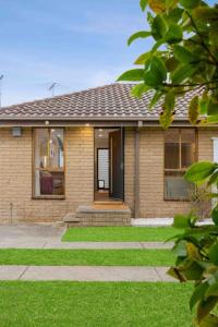 a brick house with a walkway in front of it at Terra Mare in Geelong West