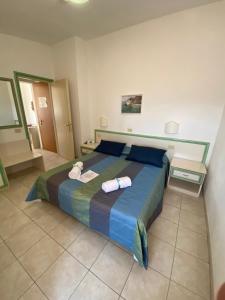 Postel nebo postele na pokoji v ubytování Hotel Due Torri
