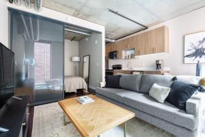 a living room with a couch and a table at Downtown Studio w Gym WD walkable location SEA-47 in Seattle