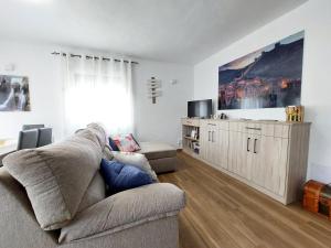 TV a/nebo společenská místnost v ubytování Apartamentos El Pozo