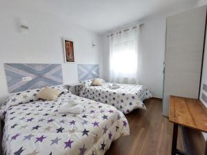 Postel nebo postele na pokoji v ubytování Apartamentos El Pozo