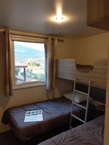a room with two bunk beds and a window at Camping TIKITI in Propriano +67 photos