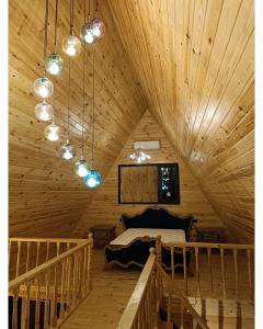 a room with a bed in a wooden ceiling at 7Sense Nature Resort in Sapanca
