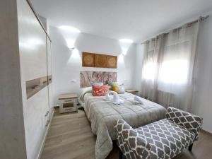 Postel nebo postele na pokoji v ubytování Apartamentos El Pozo