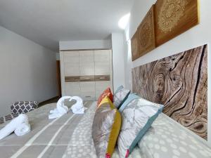 Postel nebo postele na pokoji v ubytování Apartamentos El Pozo