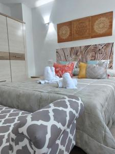Postel nebo postele na pokoji v ubytování Apartamentos El Pozo