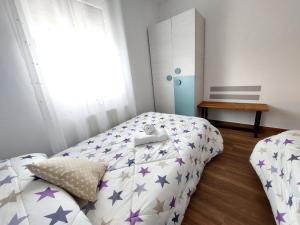 Postel nebo postele na pokoji v ubytování Apartamentos El Pozo