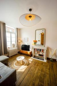 Posezení v ubytování Gîte La Petite Ourse - gîte de charme citadin + 37 fotografií
