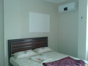 A bed or beds in a room at Nemrut Dağı Işik Pansi̇on