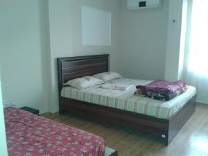 A bed or beds in a room at Nemrut Dağı Işik Pansi̇on