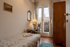 Postel nebo postele na pokoji v ubytování B&B I FILOKSENIA